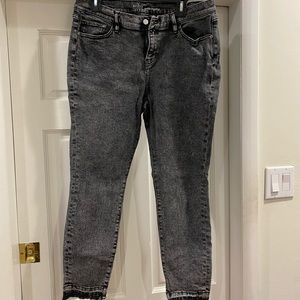 Black distressed jeans with distressed ankle seam